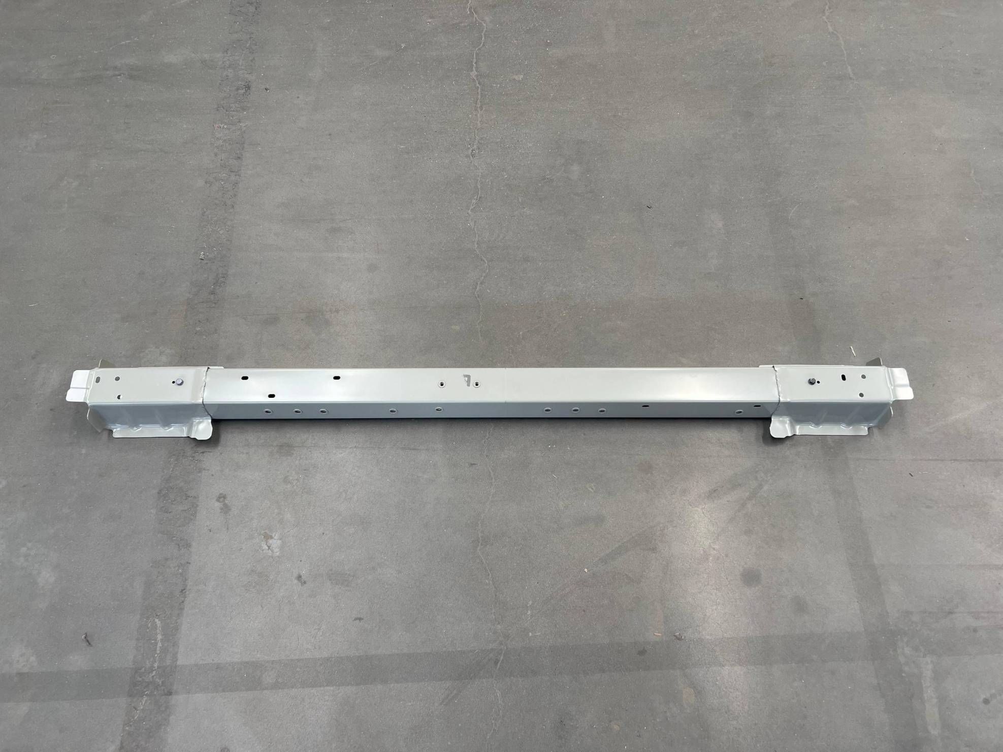 Center Floor Front Crossmember Assembly