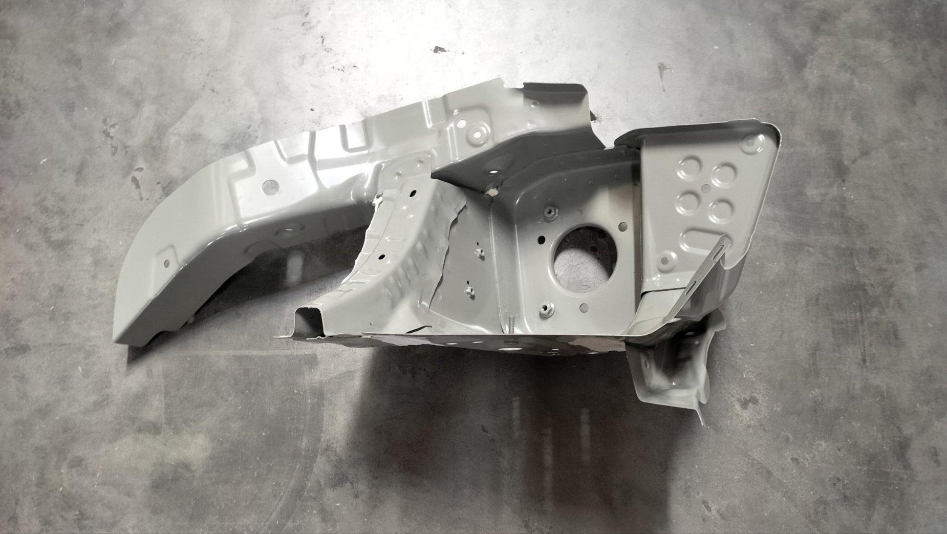 Left front wheel housing assembly